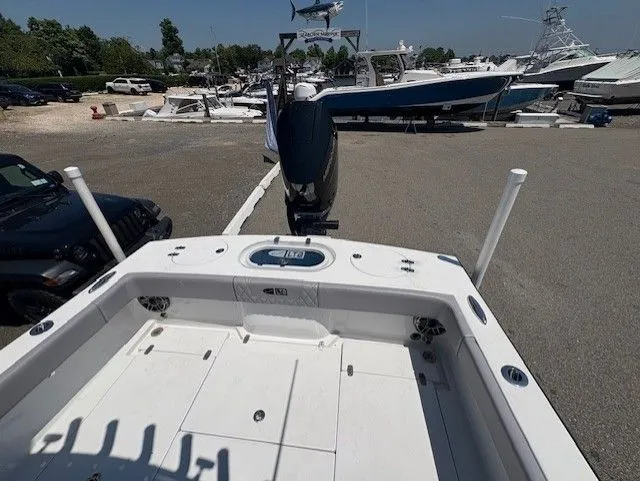 Slide: The Image of 2025 Latitude Tournament Boats 25 at marina, showcasing spacious deck and modern design. - 8
