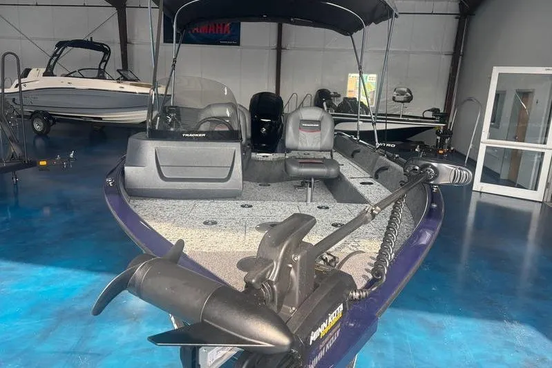 Slide: The Image of 2026 Tracker PG V16 SC boat in showroom, featuring modern design and equipment. - 5