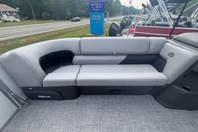 Slide: The Image of 2026 Sun Tracker PB 20 DLX pontoon boat with gray seating and outdoor view. - 10
