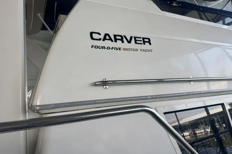 Slide: The Image of 1998 Carver 405 Motor Yacht exterior with model name visible. - 10