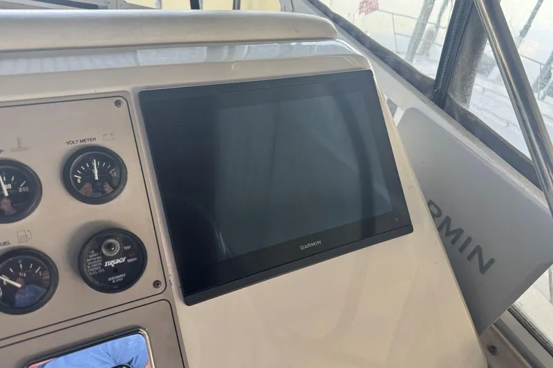 Slide: The Image of Dashboard of 1998 Carver 405 Motor Yacht with Garmin display and gauges. - 27