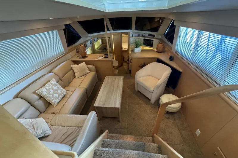 Slide: The Image of Luxurious interior of 1998 Carver 405 Motor Yacht with plush seating and modern decor. - 31