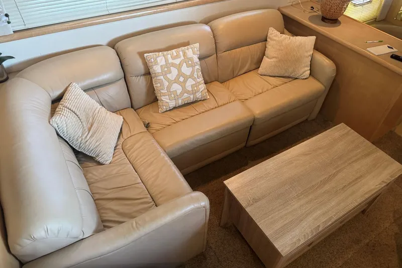 Slide: The Image of Luxurious beige leather seating area inside a 1998 Carver 405 Motor Yacht. - 32