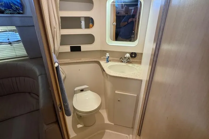 Slide: The Image of Bathroom interior of 1998 Carver 405 Motor Yacht with toilet, sink, and mirror. - 48