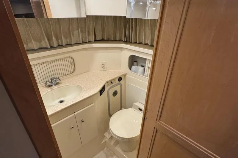 Slide: The Image of Bathroom interior of 1998 Carver 405 Motor Yacht with sink and toilet. - 54