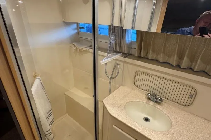 Slide: The Image of Bathroom interior of 1998 Carver 405 Motor Yacht with shower and sink. - 55