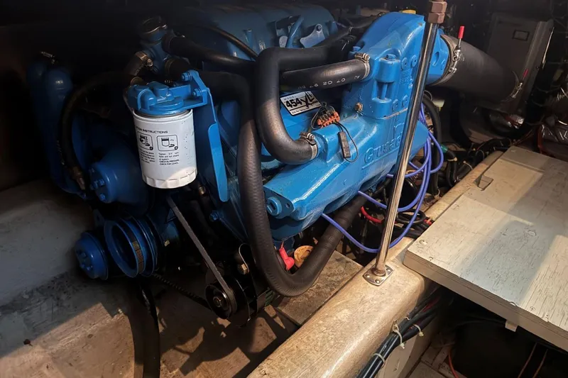 Slide: The Image of Engine of a 1998 Carver 405 Motor Yacht, featuring blue components and detailed wiring. - 58