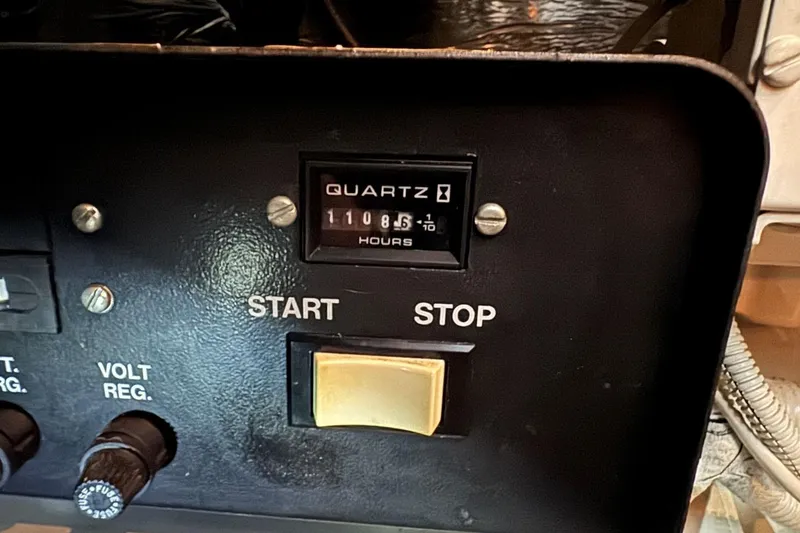 Slide: The Image of Control panel of a 1998 Carver 405 Motor Yacht with hour meter reading 1108.6 hours. - 64