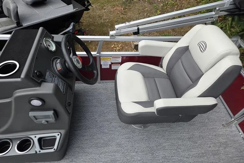Slide: The Image of Captain's seat and console of 2026 Sun Tracker BB 16 XLS pontoon boat. - 11