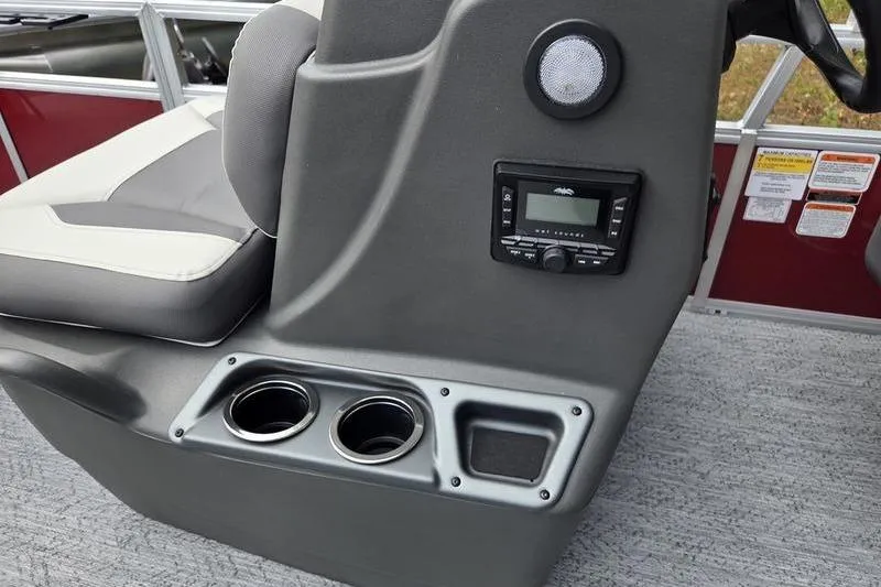 Slide: The Image of Interior of 2026 Sun Tracker BB 16 XLS boat with console, cup holders, and audio system. - 8