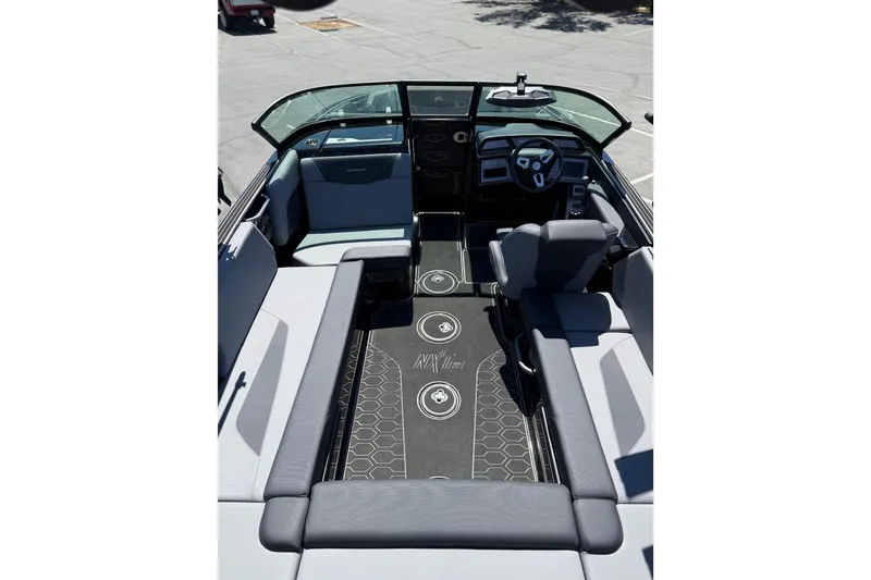 Slide: The Image of 2025 MasterCraft NXT22 boat interior with modern seating and sleek dashboard design. - 10