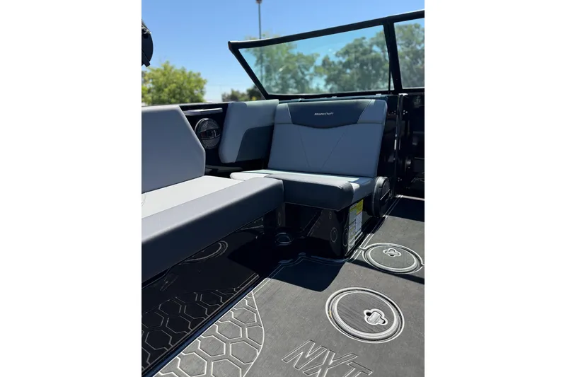 Slide: The Image of 2025 MasterCraft NXT22 interior with sleek seating and modern design elements. - 16