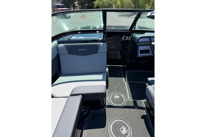 Slide: The Image of 2025 MasterCraft NXT22 interior with sleek seating and modern dashboard design. - 17