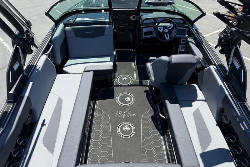 Slide: The Image of Interior of 2025 MasterCraft NXT22 boat, featuring sleek seating and modern dashboard design. - 9