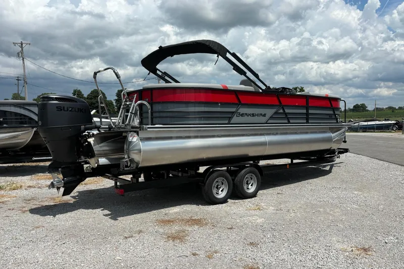 Slide: The Image of 2026 Berkshire 24RFX CTS pontoon boat with Suzuki engine on a trailer. - 1
