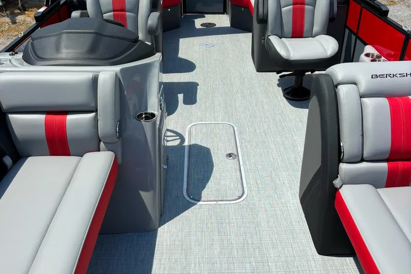 Slide: The Image of 2026 Berkshire 24RFX CTS boat interior with gray and red seating, modern design. - 6