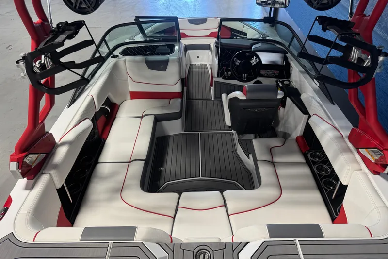 Slide: The Image of 2019 Nautique Super Air Nautique GS20 interior with red accents and spacious seating. - 5