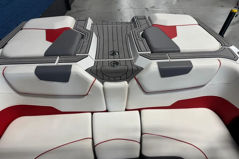 Slide: The Image of 2019 Nautique Super Air Nautique GS20 boat interior with red, gray, and white seating. - 6