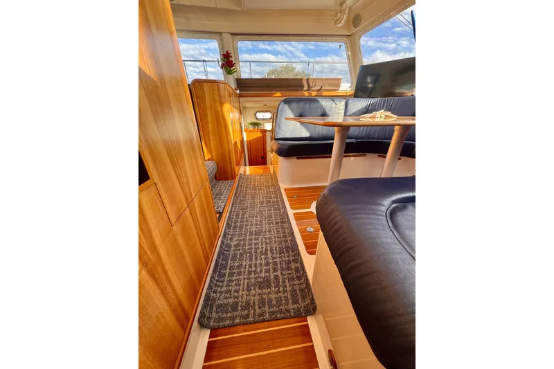 Slide: The Image of Interior of 2006 PDQ PowerCat with wooden finishes and comfortable seating. - 14