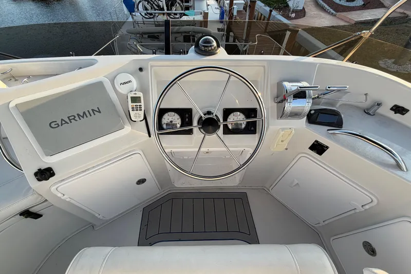 Slide: The Image of 2006 PDQ PowerCat helm with Garmin navigation, steering wheel, and control panel. - 23