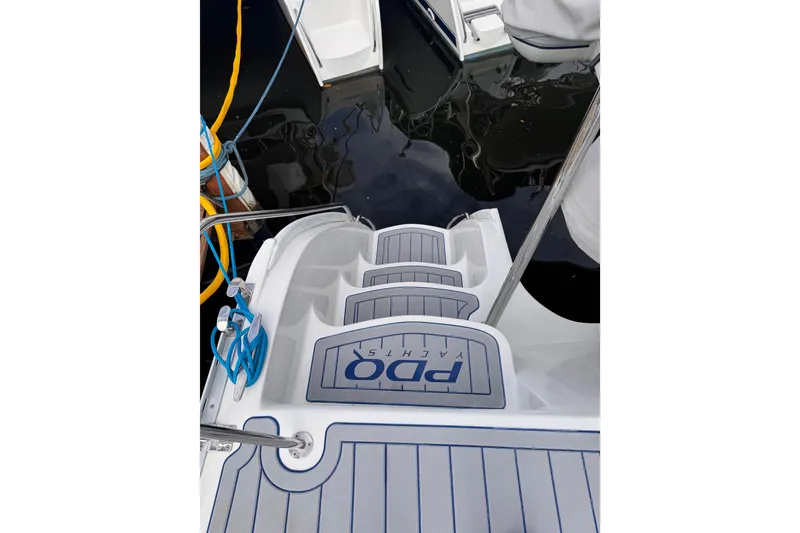 Slide: The Image of 2006 PDQ PowerCat yacht deck with blue ropes and water reflection. - 28