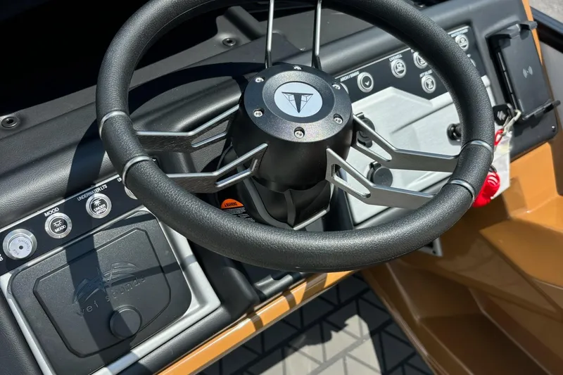 Slide: The Image of Steering wheel and dashboard of 2026 Trifecta 23 ULE SS boat. - 11
