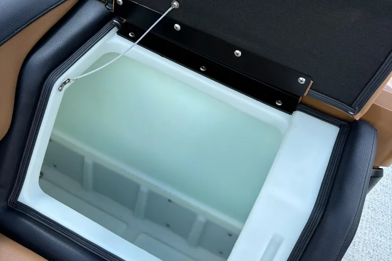 Slide: The Image of Open storage compartment in 2026 Trifecta 23 ULE SS boat, featuring sleek design and durable materials. - 13
