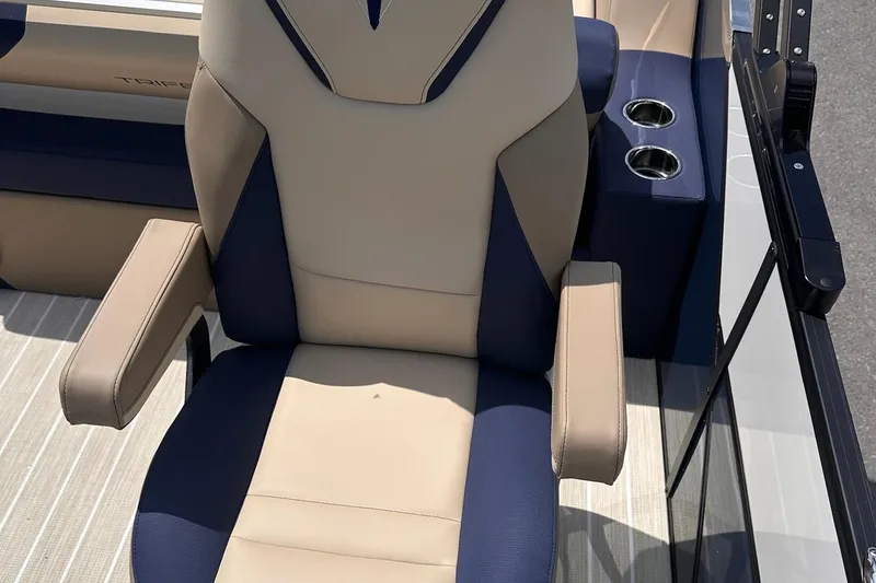 Slide: The Image of 2026 Trifecta 23 ULE SS boat seat with beige and navy design, featuring cup holders. - 12