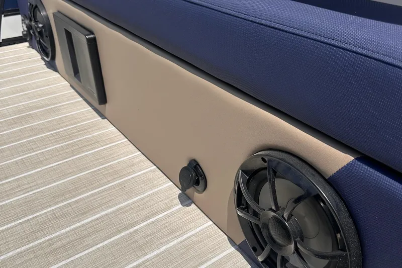 Slide: The Image of 2026 Trifecta 23 ULE SS boat interior with speakers and blue upholstery. - 16