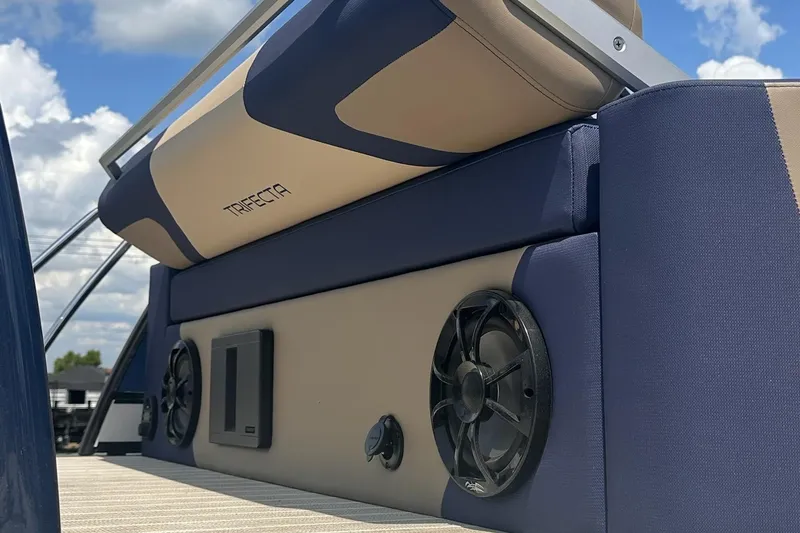 Slide: The Image of 2026 Trifecta 23 ULE SS boat interior with speakers and cushioned seating. - 3