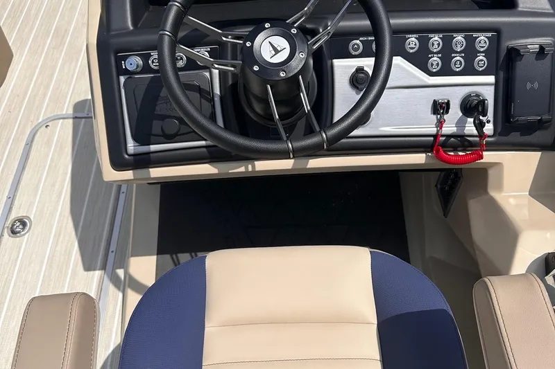 Slide: The Image of Captain's seat and control panel of 2026 Trifecta 23 ULE SS boat. - 7