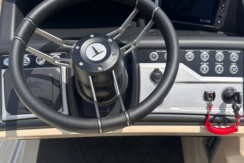 Slide: The Image of Steering wheel and control panel of 2026 Trifecta 23 ULE SS boat. - 8