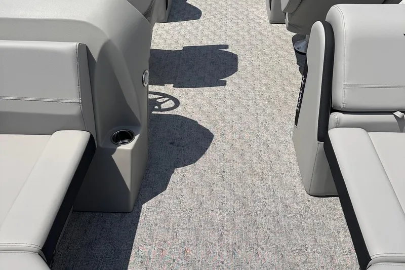 Slide: The Image of Interior of 2026 Trifecta 22 RF LE boat with gray seating and carpet flooring. - 13