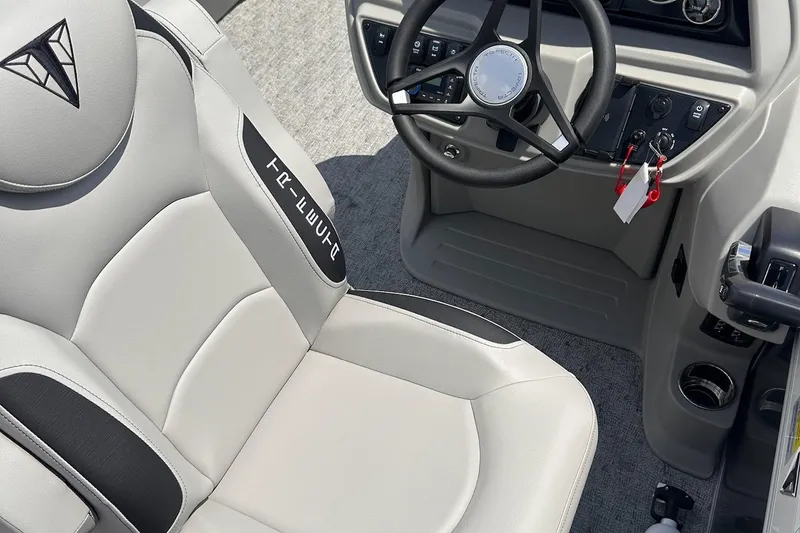 Slide: The Image of Captain's seat and steering console of 2026 Trifecta 22 RF LE boat, featuring modern design. - 5