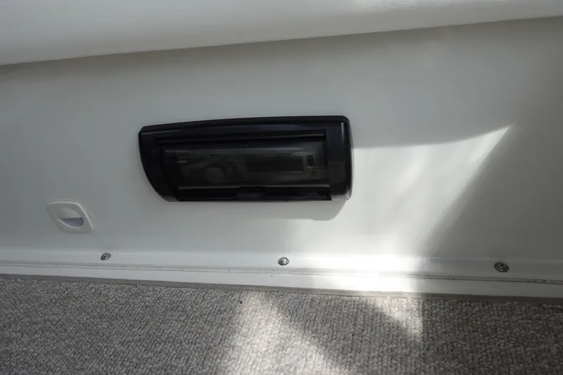 Slide: The Image of 1993 Silverton 31 Convertible interior detail with black panel and carpeted floor. - 17