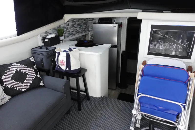 Slide: The Image of Interior of a 1993 Silverton 31 Convertible boat with modern decor and kitchenette. - 20