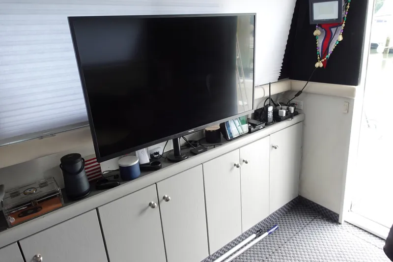 Slide: The Image of Interior of 1993 Silverton 31 Convertible with TV and cabinets. - 21