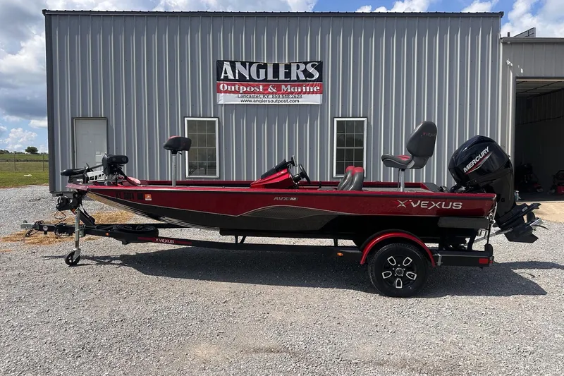 Slide: The Image of 2021 Vexus AVX181 boat in front of Anglers Outpost & Marine building. - 1