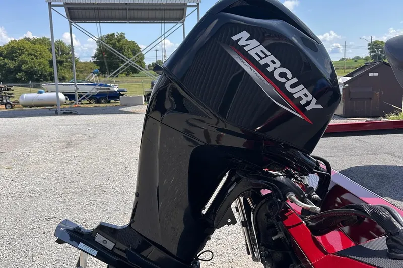 Slide: The Image of 2021 Vexus AVX181 with Mercury outboard motor in a sunny outdoor setting. - 11