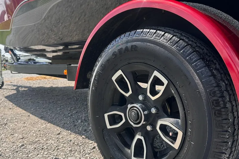 Slide: The Image of Close-up of a 2021 Vexus AVX181 trailer wheel with red fender. - 13