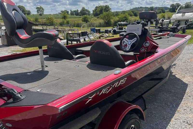 Slide: The Image of 2021 Vexus AVX181 boat with red and black design, featuring Garmin electronics. - 3