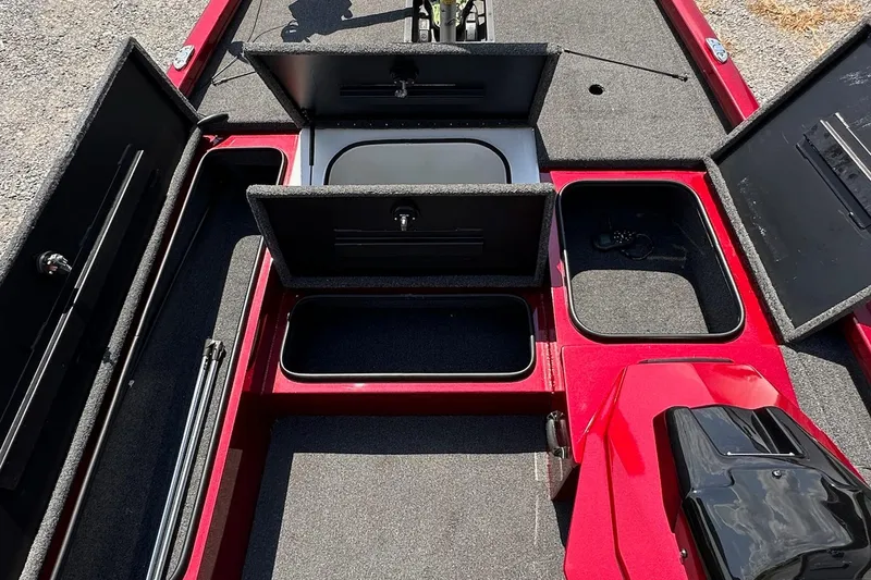 Slide: The Image of 2021 Vexus AVX181 boat interior with open storage compartments and red finish. - 8