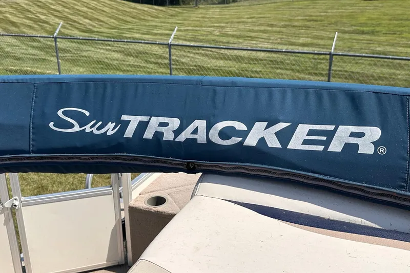 Slide: The Image of 2008 Sun Tracker FISHIN' BARGE 21 Signature Series boat with blue canopy. - 26