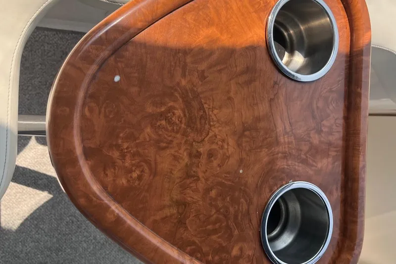 Slide: The Image of Wooden table with two cup holders on a 2004 Rinker Fiesta Vee 270 boat. - 21