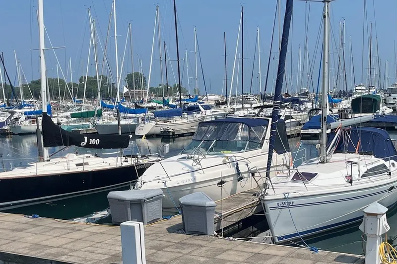 Slide: The Image of Interior view of 2004 Rinker Fiesta Vee 270 boat cockpit with steering wheel and controls. - 3
