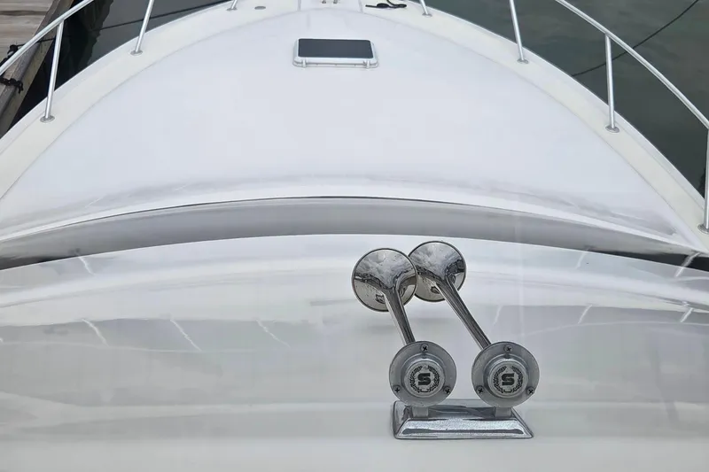 Slide: The Image of 2004 Ocean Yachts 43 Super Sport yacht bow with chrome horns and sleek design. - 26