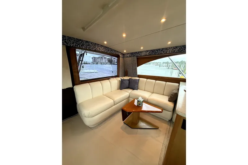 Slide: The Image of Luxurious interior of 2004 Ocean Yachts 43 Super Sport with white leather seating and scenic window view. - 30