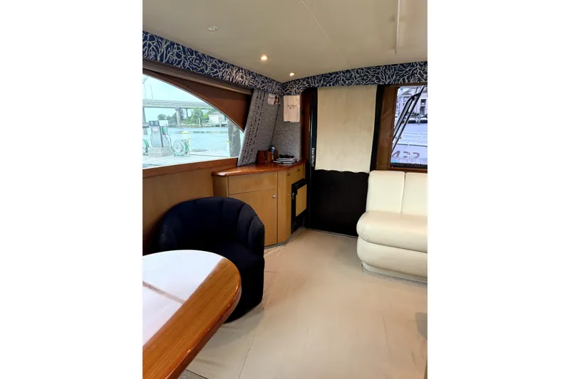 Slide: The Image of Interior of 2004 Ocean Yachts 43 Super Sport with elegant seating and wood accents. - 34