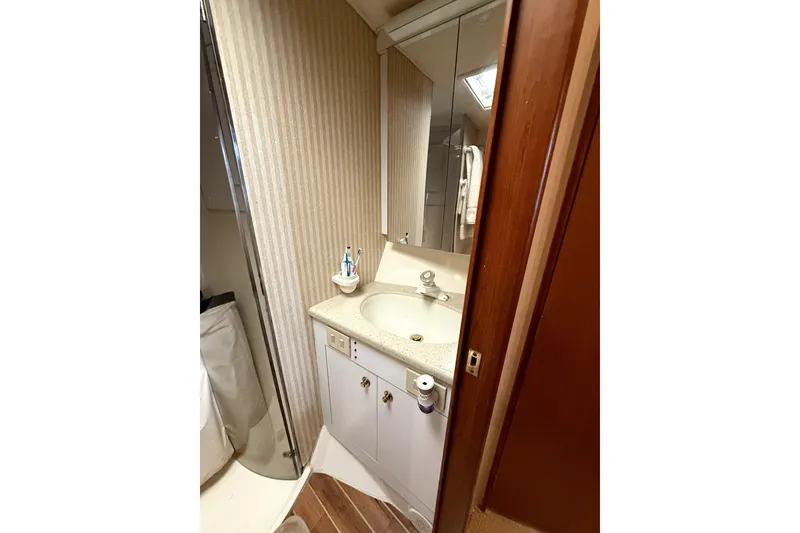 Slide: The Image of Bathroom interior of 2004 Ocean Yachts 43 Super Sport with sink and mirror. - 36