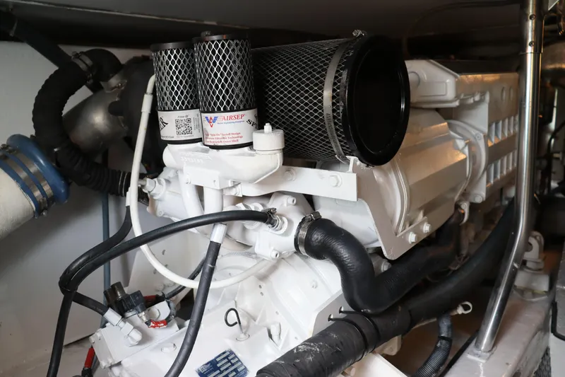 Slide: The Image of Engine room of 2004 Ocean Yachts 43 Super Sport, showcasing detailed machinery components. - 8
